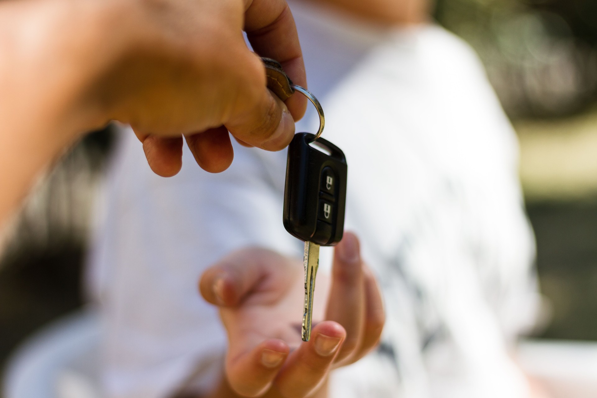 Be Safe. Girl receives the key of her new car